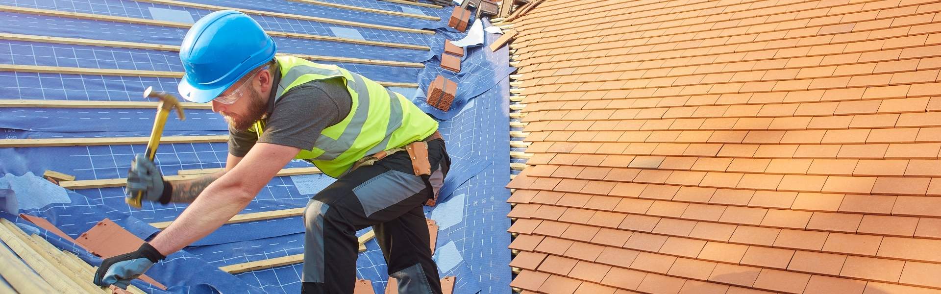 Roofer working on roof